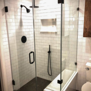 A shower stall with a glass cover