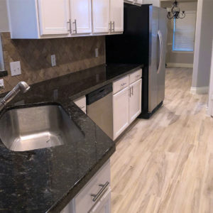 Kitchen countertops, sink, and appliances